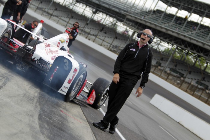 Helio Castroneves peels out of pit lane for practice for the Indianapolis 500 at the Indianapolis Motor Speedway