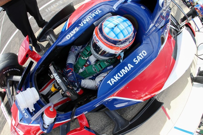 Takuma Sato sits in his car